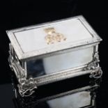 A fine quality Victorian cast-silver and gold desk casket, rectangular form, with hand planished