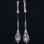 A pair of Art Deco diamond openwork pendant earrings, unmarked gold and platinum settings with old