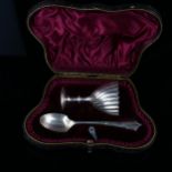 A Victorian silver egg cup and spoon set, twisted fluted decoration, indistinct maker's marks,