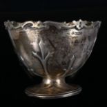 An Edwardian silver Gothic pedestal bowl, with raised decoration, by James Deakin & Sons,