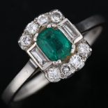 An Art Deco platinum emerald and diamond ring, set with octagonal step-cut emerald, and baguette and
