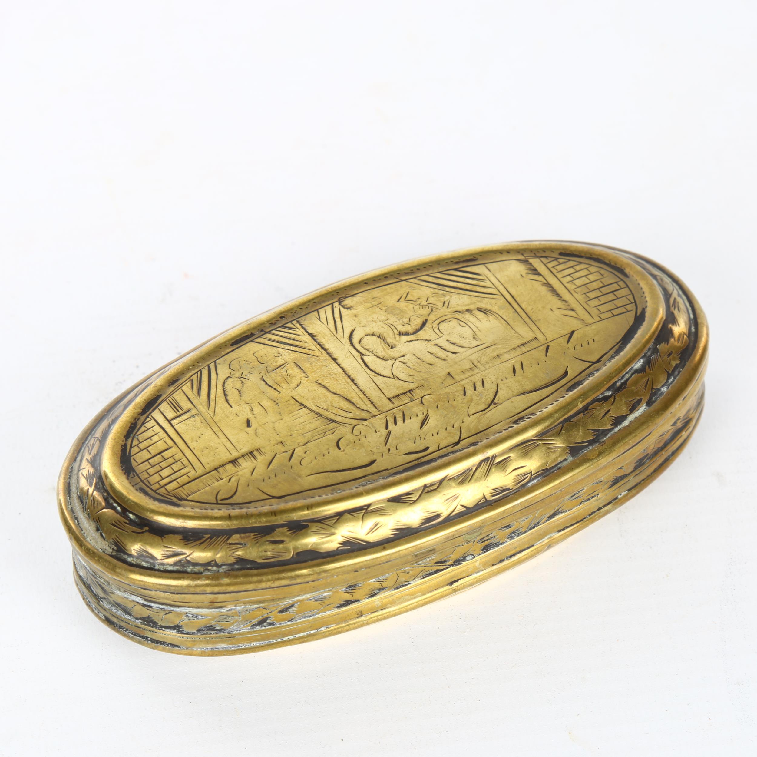 An 18th century Dutch engraved brass tobacco box, length 13.5cm Hinge has an old repair,