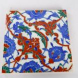 A Middle Eastern Iznik pottery tile, 25cm x 25cm Small glaze chips along the edges