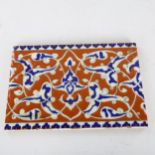 A Middle Eastern Iznik pottery tile, 16.5cm x 24cm Some very small glaze chips along the edges