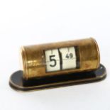 An Art Deco brass drum-cased split flap desk timepiece, by Endura Time Corp West Germany, on black