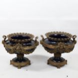 Pair of ornate gilt-bronze and blue glazed ceramic urns, with Classical mask handles, height 37cm,