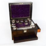 A 19th century coromandel travelling box, the interior fitted with cut-glass and electroplate boxes,