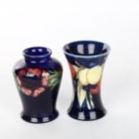 2 small Moorcroft pottery vases, height 9cm (2) Vase with flared rim has a very fine hairline