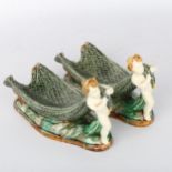 Pair of Wedgwood Majolica bowls in the form of Classical boys pulling fishing nets, impressed