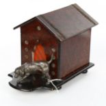 An early 20th century amboyna dog kennel design cigar box, surmounted by an electroplate dog, length