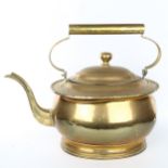 A very large brass kettle, probably early 20th century, overall length 50cm Good condition