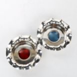 A pair of electroplate wine coasters, with blue and red enamel centre panels and frilled edges,