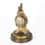 19th century French gilt-metal cased miniature clock, surmounted by a figure of Napoleon, movement
