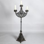 Boris Karloff, a Gothic style wrought-iron floor standing 3-branch lamp, with pierced metal panels