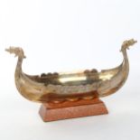 A Scandinavian electroplate table centre bowl, in the form of a Viking longboat, on hardwood