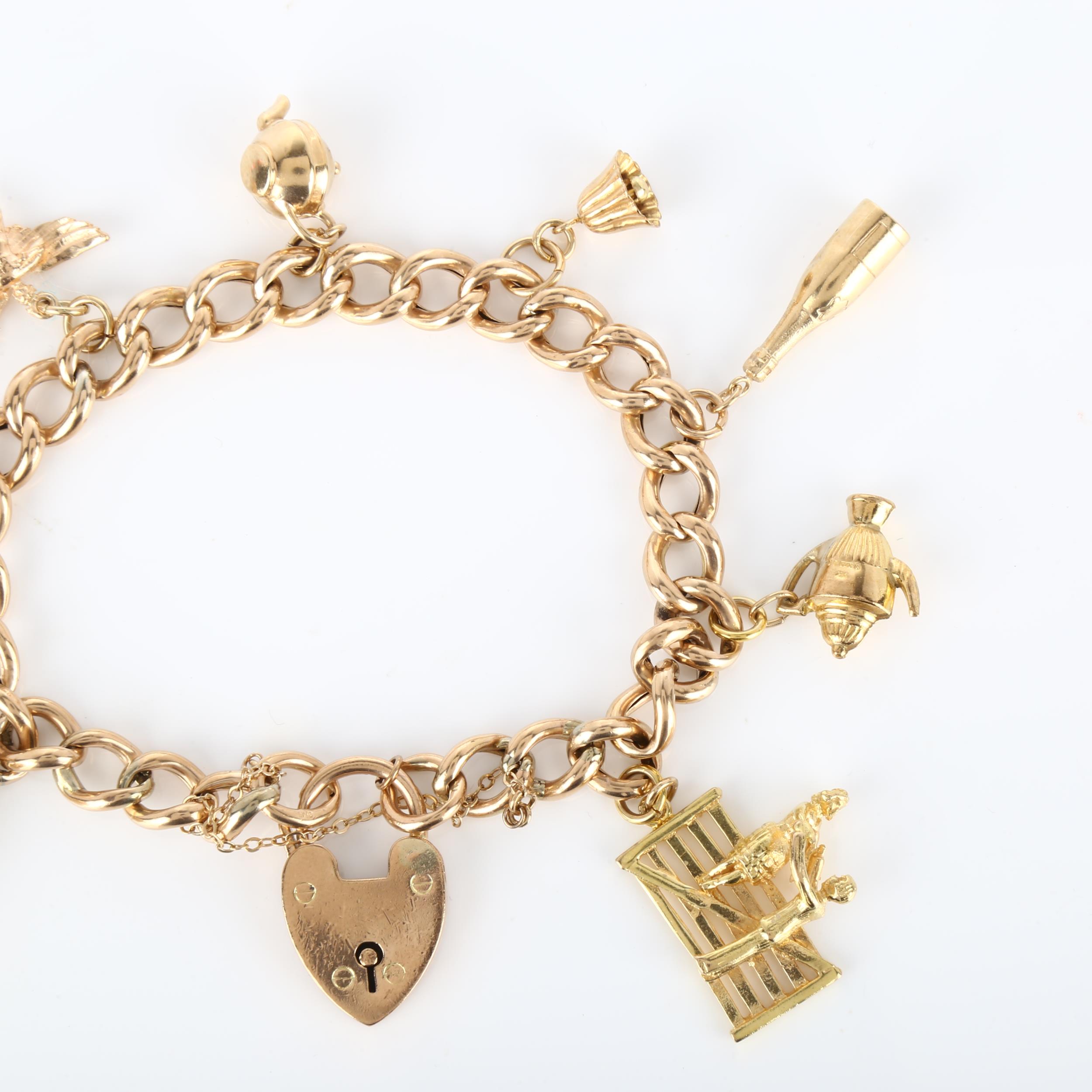 A mid-20th century 9ct gold hollow curb link charm bracelet, with 8 gold charms and heart padlock - Image 2 of 4