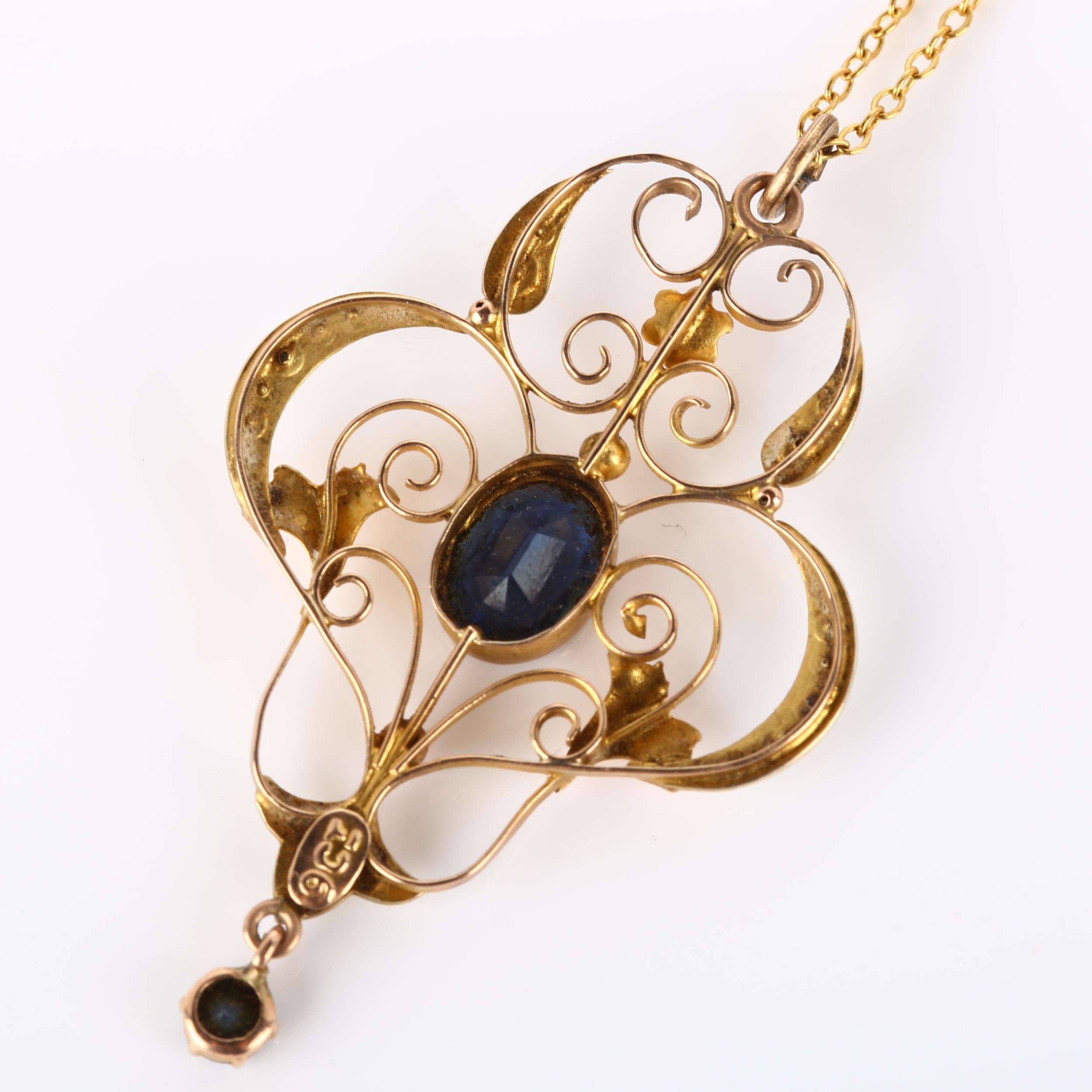 An Edwardian Art Nouveau 9ct gold stone set openwork pendant necklace, set with oval mixed-cut - Image 3 of 4