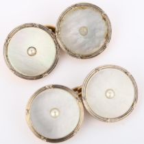 A pair of Art Deco 9ct rose gold mother-of-pearl cufflinks, circular panels with central split