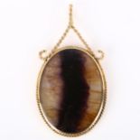 A late 20th century 9ct gold Blue John pendant, oval cabochon Blue John in 9ct twist frame, maker'