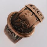 An early 20th century 9ct rose gold belt buckle band ring, engraved floral decoration, maker's marks
