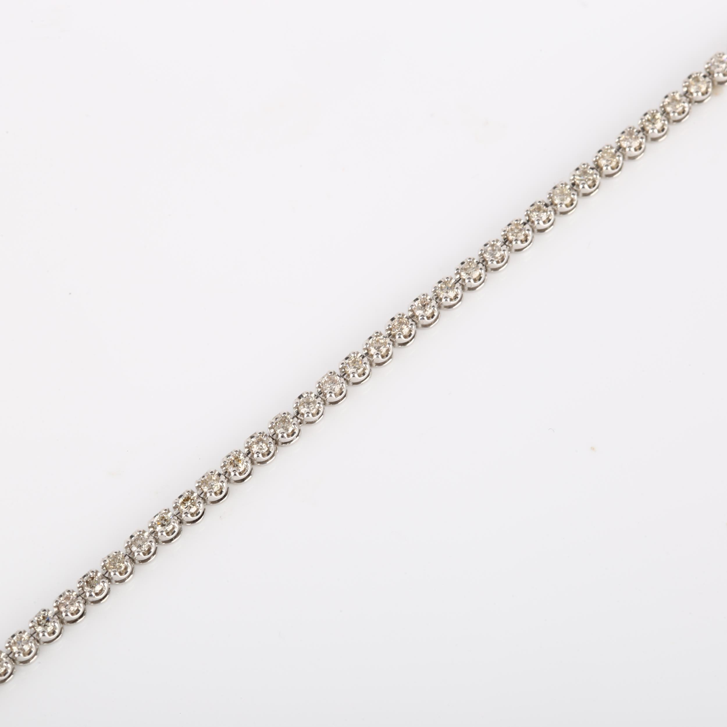 A modern 18ct white gold diamond tennis line bracelet, set with modern round brilliant-cut diamonds, - Image 2 of 4