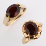 2 x 9ct gold garnet rings, sizes O and P, 7.3g total (2) Garnets have abraded facet edges, tank