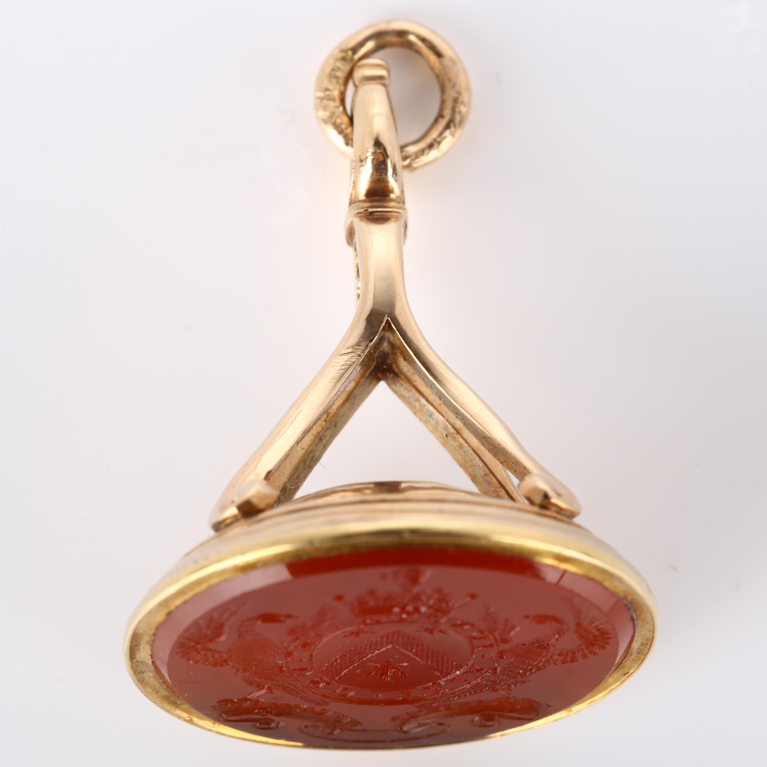 A large Victorian armorial seal fob, intaglio carved carnelian with Order Of The Bath motto "Tria - Image 2 of 4