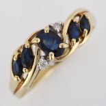 A modern 9ct gold sapphire and diamond dress ring, setting height 7.2mm, size N, 2.7g No damage or