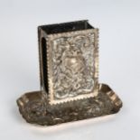 A late Victorian silver upright matchbox holder, relief embossed foliate decoration with crimped