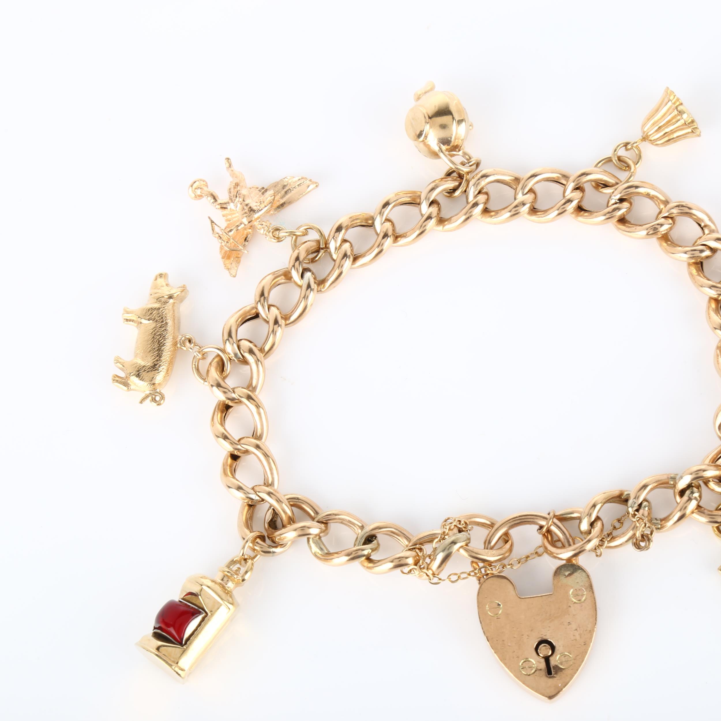 A mid-20th century 9ct gold hollow curb link charm bracelet, with 8 gold charms and heart padlock - Image 3 of 4