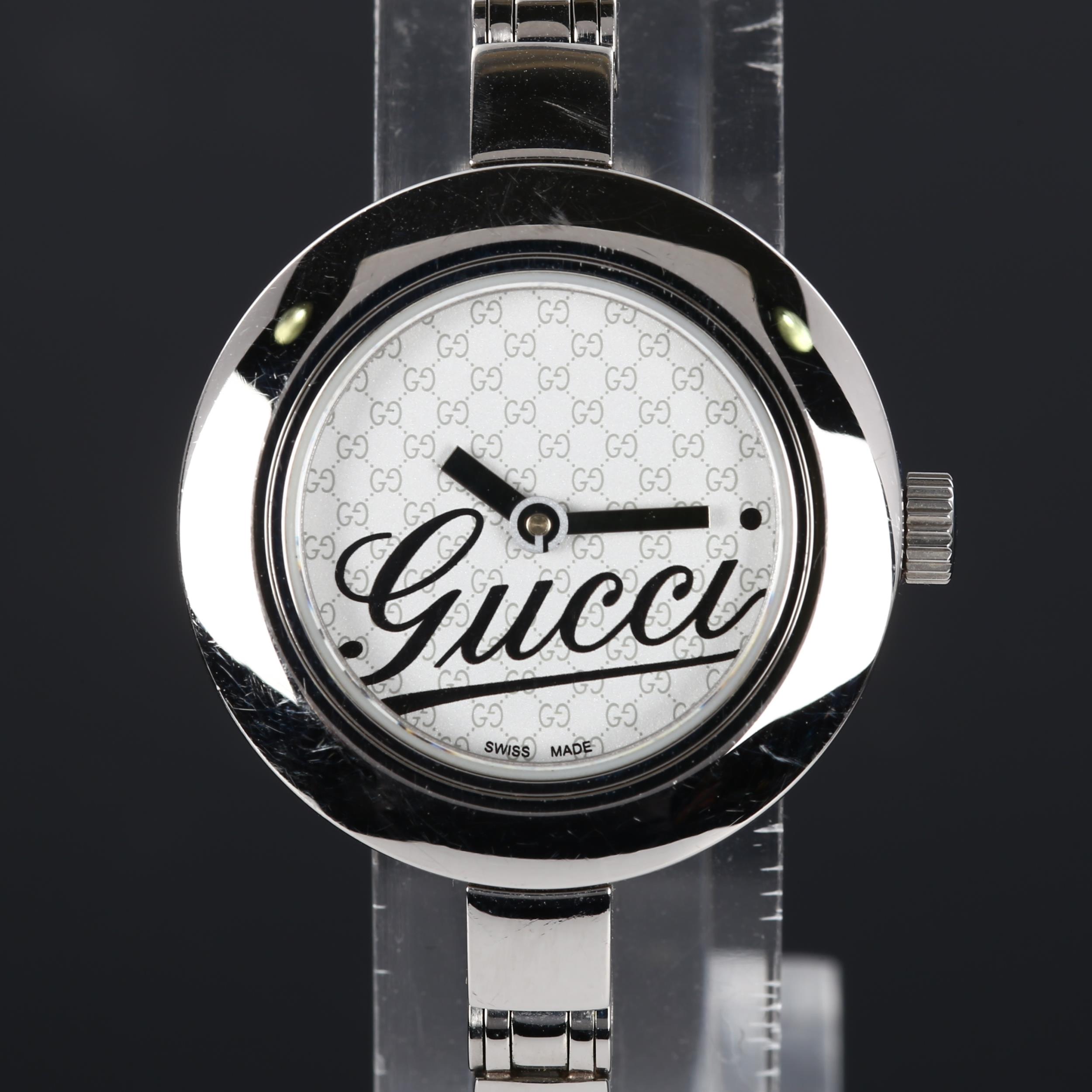 GUCCI - a lady's stainless steel quartz bracelet watch, ref. 105, Gucci GG monogram dial with bangle