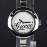 GUCCI - a lady's stainless steel quartz bracelet watch, ref. 105, Gucci GG monogram dial with bangle