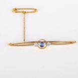 An Art Deco 15ct gold three stone sapphire and diamond bar brooch, brooch length 53.6mm, 3.2g No