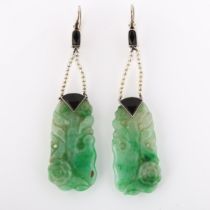 A pair of Art Deco jade onyx and seed pearl drop earrings, with carved and polished jade panels