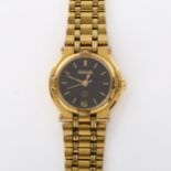 GUCCI - a lady's gold plated 9200L quartz bracelet watch, black dial with gilt baton hour markers,