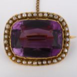 A Victorian 9ct gold amethyst and pearl cluster brooch, set with large cushion-cut amethyst and
