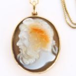 An Antique hardstone cameo pendant necklace, relief carved panel possibly depicting Jupiter with