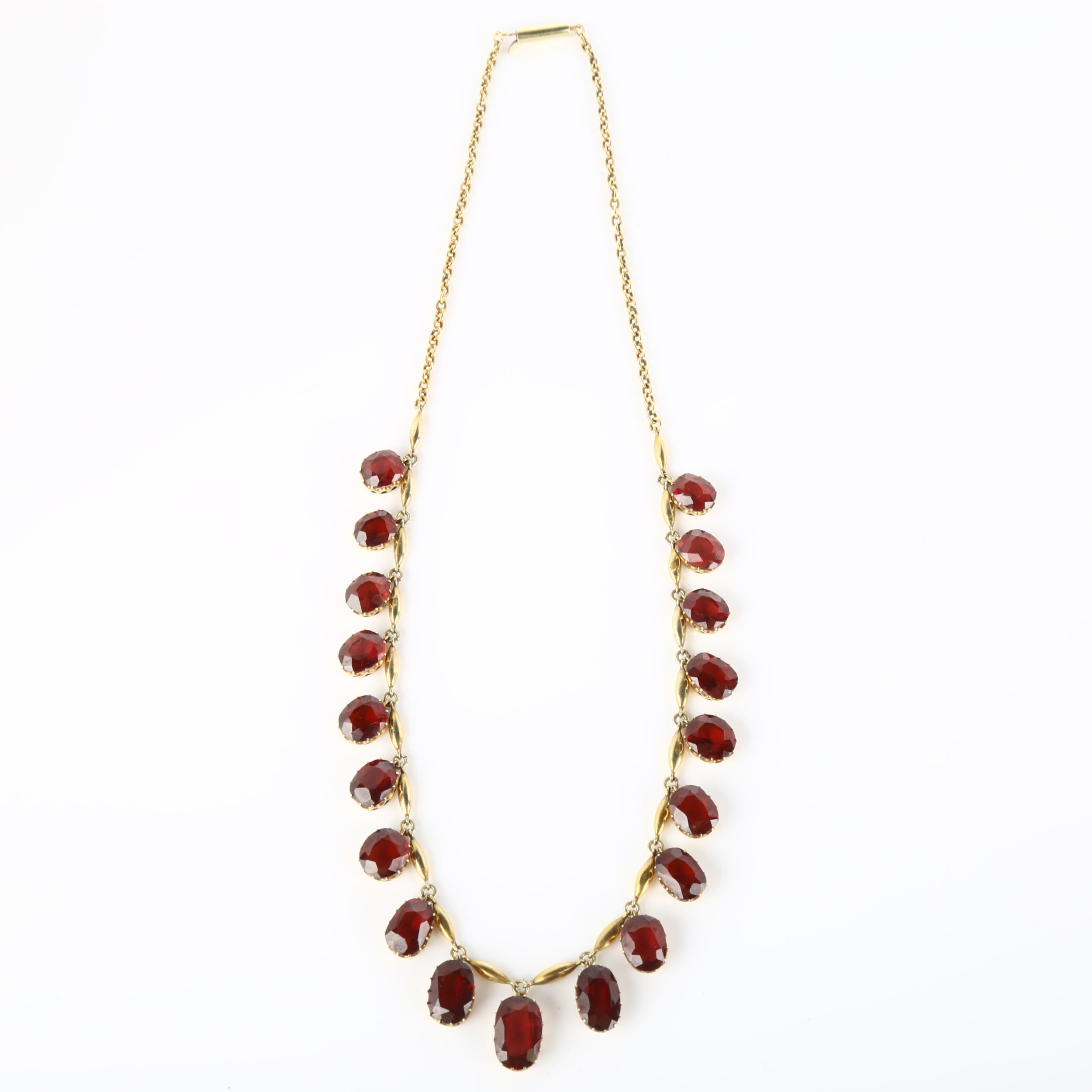 An Edwardian garnet fringe necklace, unmarked yellow metal settings with graduated oval mixed-cut - Image 3 of 4