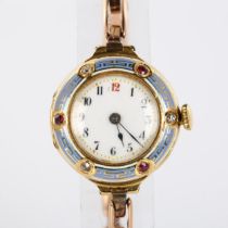 An early 20th century lady's 18ct gold mechanical bracelet watch, white enamel dial with hand