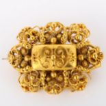 A Victorian Etruscan Revival brooch, unmarked gold settings with cannetille decoration, brooch
