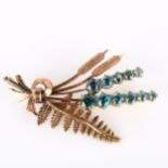 A late 20th century 9ct gold blue zircon floral brooch, with fern and bulrush decoration, maker's
