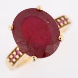 A modern 9ct gold ruby dress ring, with ruby shoulders, ruby length 13.2mm, size N, 4.5g No damage