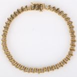 A modern 9ct gold diamond tennis line bracelet, set with modern round brilliant-cut diamonds,