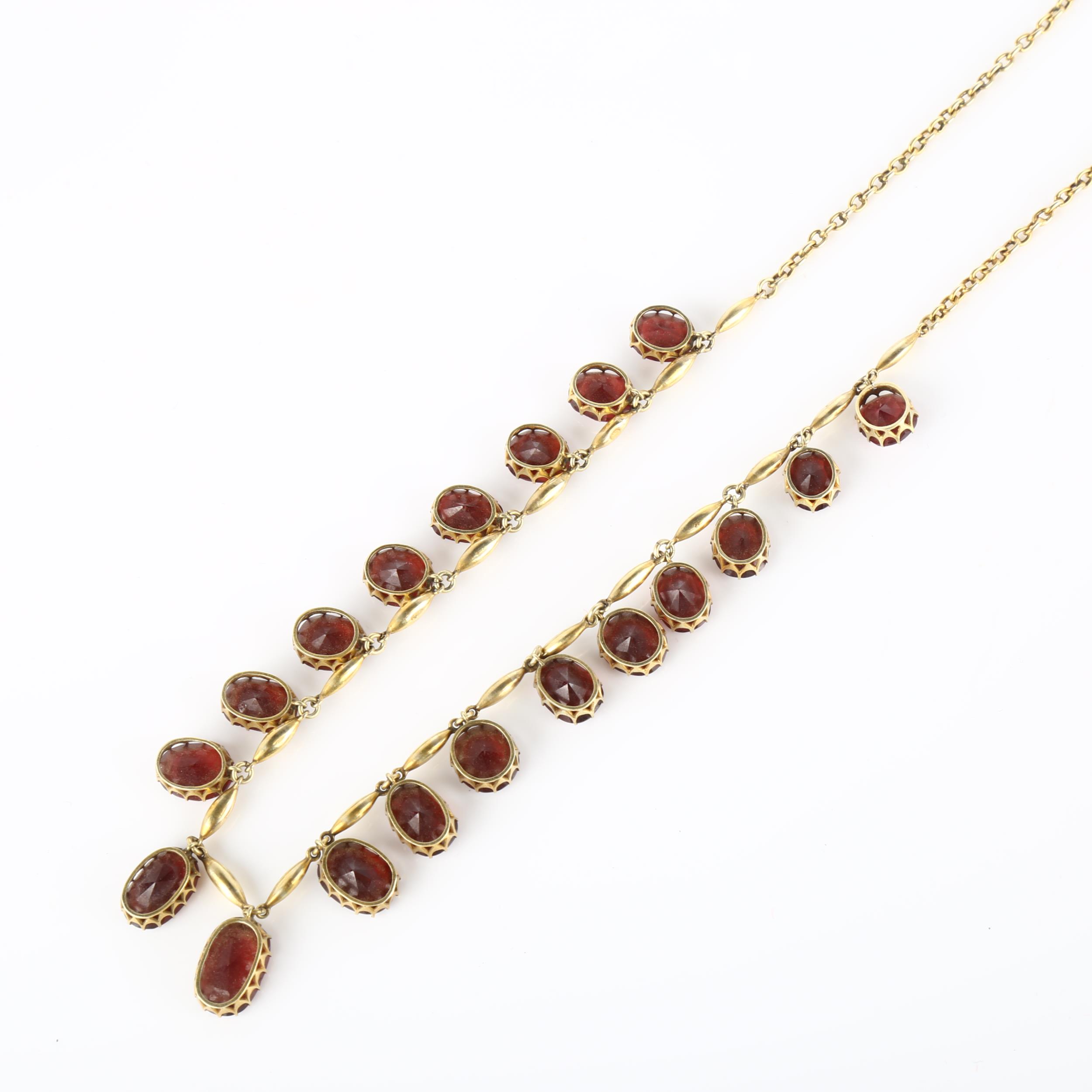 An Edwardian garnet fringe necklace, unmarked yellow metal settings with graduated oval mixed-cut - Image 4 of 4