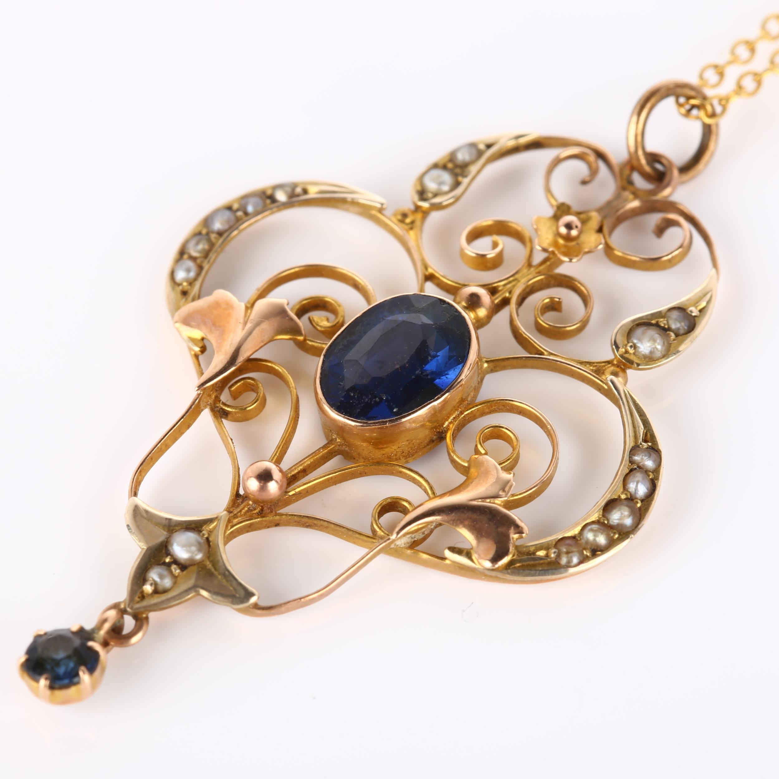 An Edwardian Art Nouveau 9ct gold stone set openwork pendant necklace, set with oval mixed-cut - Image 2 of 4