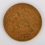 An Edward VII 1908 gold half sovereign coin, 3.9g High points quite worn, light abrasions all over