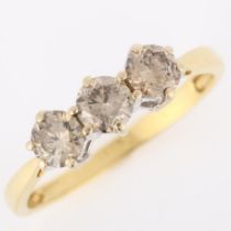 An 18ct gold three stone brown diamond ring, claw set with modern round brilliant-cut diamonds,