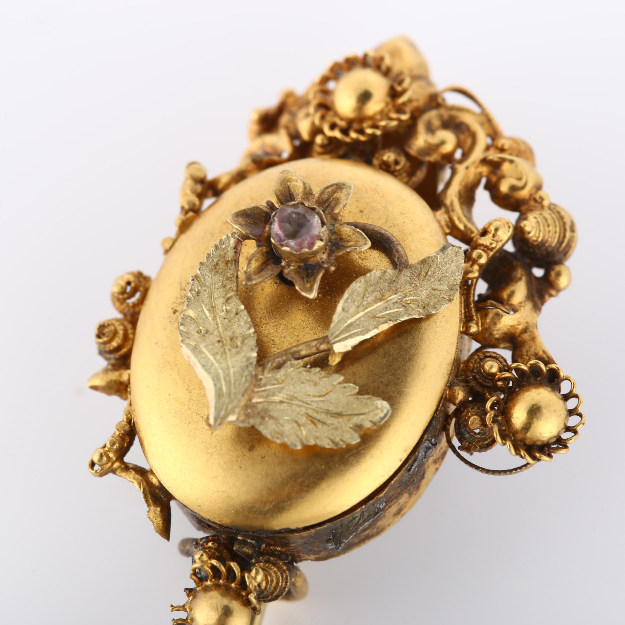 A Victorian Etruscan style mourning brooch, with stone set flower motif, cannetille surround and - Image 2 of 4
