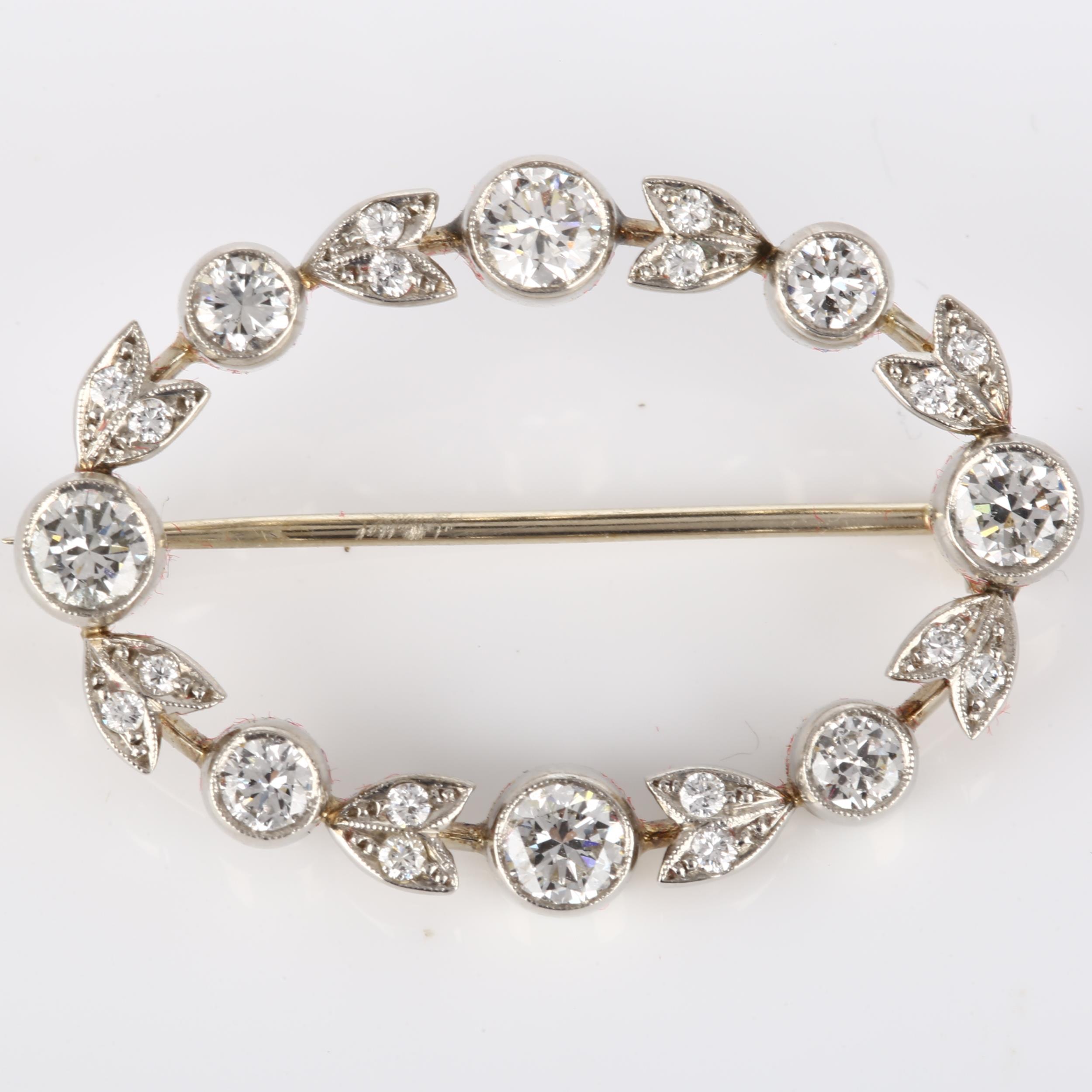 A Belle Epoque diamond brooch, openwork oval form with floral design set with modern round - Image 3 of 4