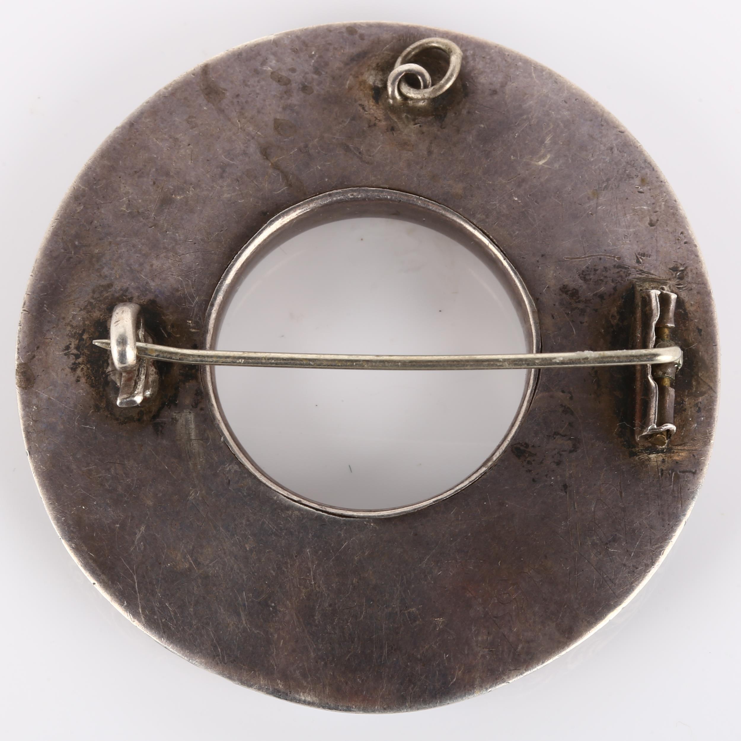 A 19th century Scottish hardstone brooch, unmarked silver closed-back settings in circular form, - Image 3 of 4